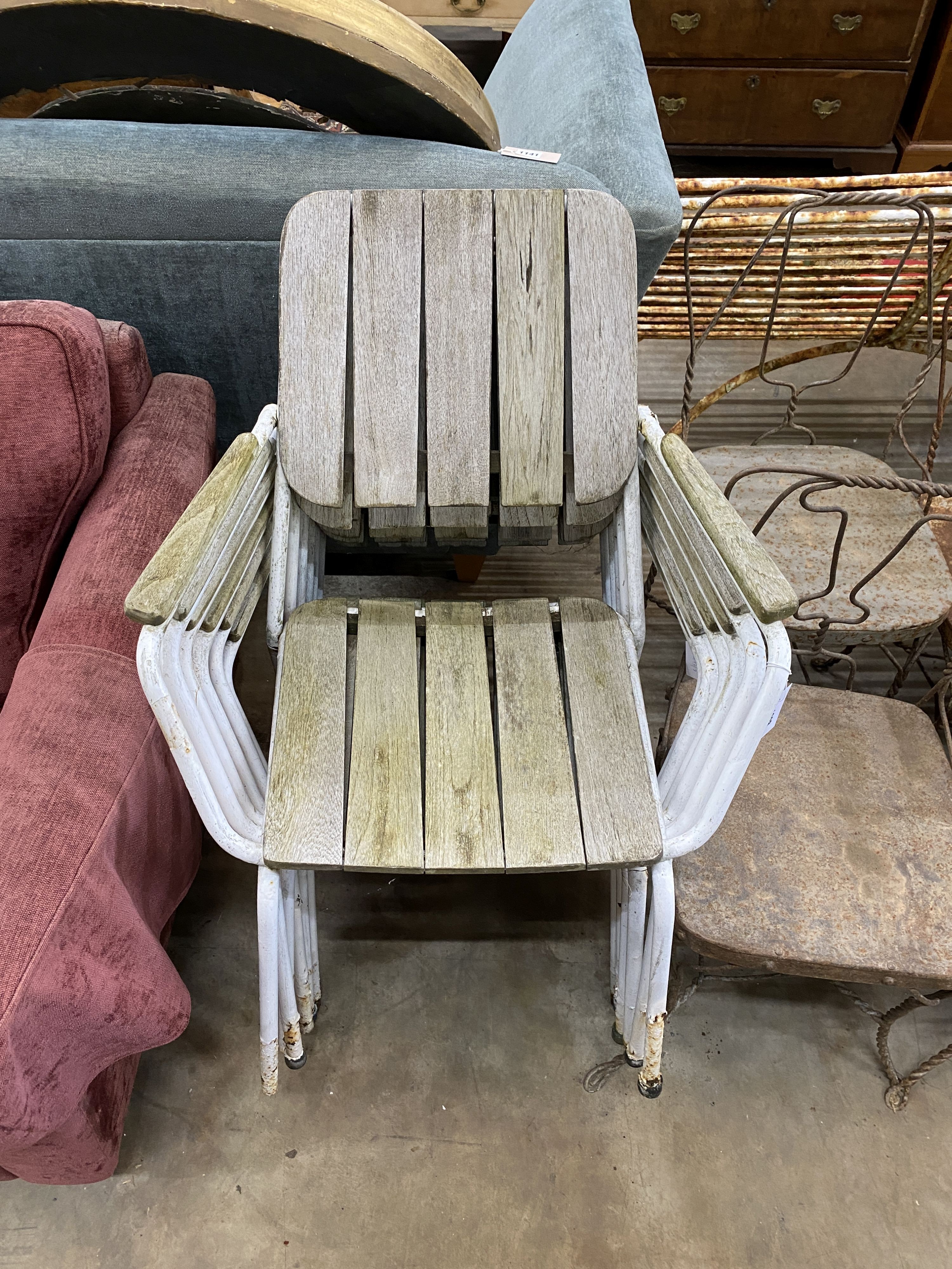 A set of six weathered teak and wrought iron stacking garden chairs, width 61cm, depth 54cm, height 80cm